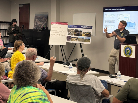 ETEC Site Manager giving a presentation to a room full of people