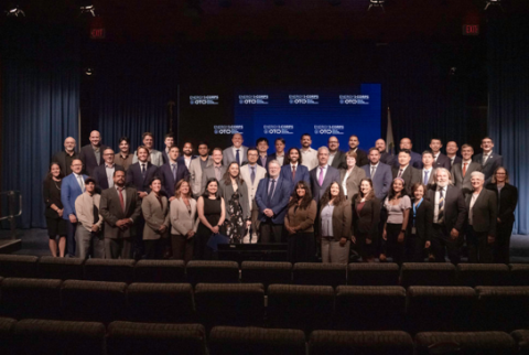 Energy I-Corps Cohort 22 members gather on stage at DOE HQ