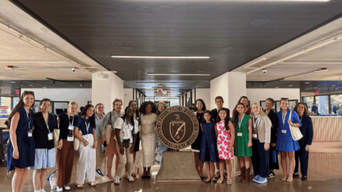 Rotating set of images if a group of high school students at the DOE Headquarters building