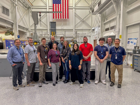 A group photo of scientists and students in a laboratory 