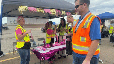 Rotating set of images of employees participating in a safety event outdoors at the Idaho Site