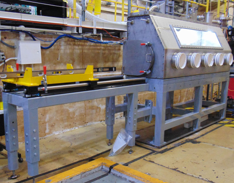 A large grey glovebox inside the Oak Ridge National Laboratory