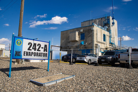 A facility building at the Hanford from the outside with a sign that reads "242-A Evaporator"