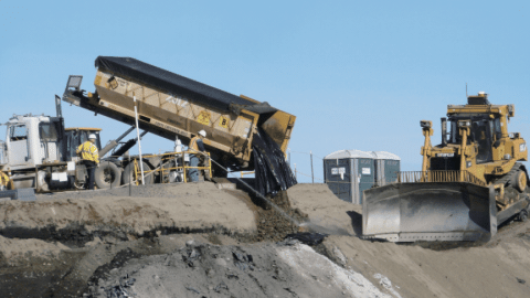 Rotating set of images of construction vehicles and employees working at the Hanford Site