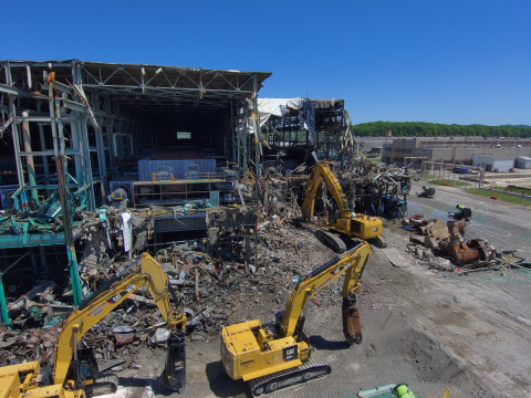 Aerial view of demolition taking place on the corner of a large building