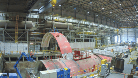Rotating set of images of a demolition occurring inside a facility building 