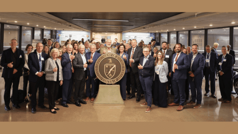 Rotating set of imaged of meetings taking place and a large group photo
