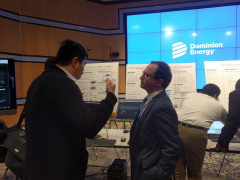 Michael Pesin, Deputy Assistant Secretary of OE’s Advanced Grid R&D Division, speaks with Duotong Yang, Engineer at Dominion Energy.