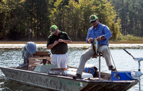 Two men fishing on at the Ultimate Fishing Challenge