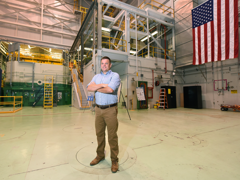 Dan Wachs stands in front of TREAT test reactor.