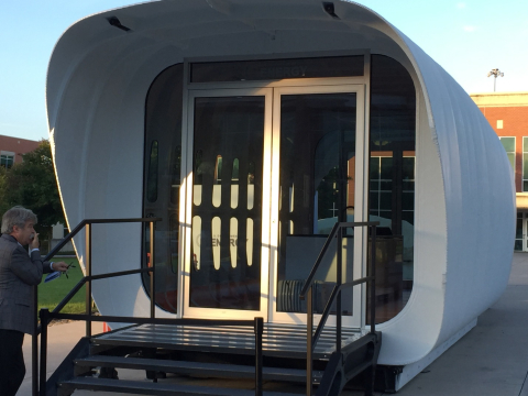 Photo of the front of the 3D-printed house.