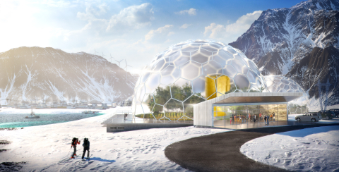 A photo that features an igloo shaped dome that houses a nuclear reactor and trees with wind turbines in the distance.