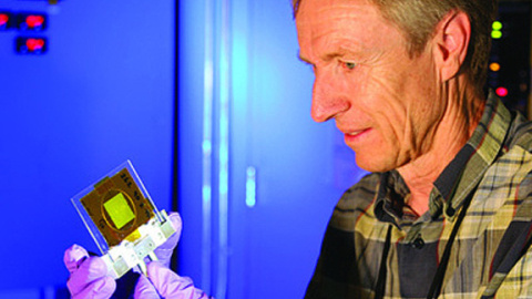 Los Alamos scientist Meiring Nortier holds a thorium foil test target for the proof-of-concept production experiments.
