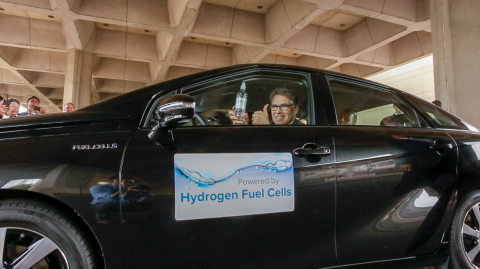 Secretary Rick Perry driving a fuel cell vehicle.