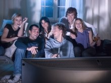 Group of friends watching television