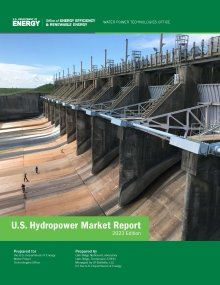 The cover of the Department of Energy's 2023 U.S. Hydropower Market Report showing a large dam with people standing along the spillway