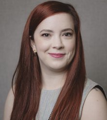 Woman smiles for the camera. 