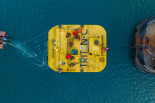 Aerial view of Oscilla's Triton-C being pulled out to sea