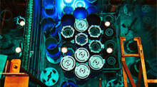 A blue glow from Cherenkov radiation in the reactor pool of the High Flux Isotope Reactor from stored fuel elements.