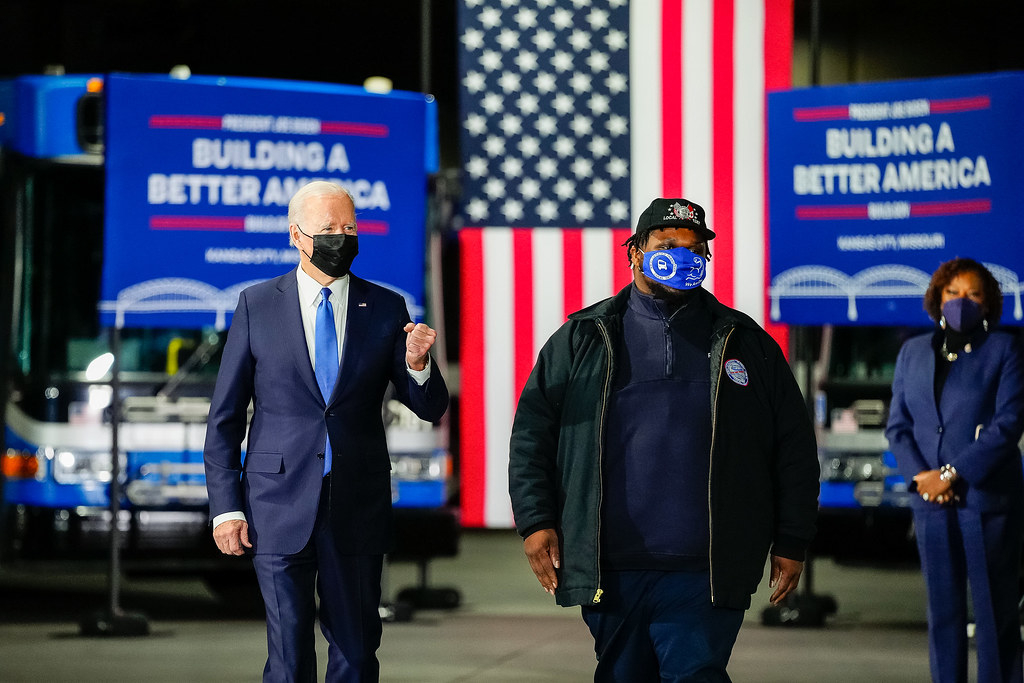 President Joe Biden arrives with bus operator Eskew Ronnell Jackson, Jr. to an event promoting the Bipartisan Infrastructure Law and Building a Better America, Wednesday, December 8, 2021, in Kansas City, Missouri. (Official White House Photo by Adam Schultz)