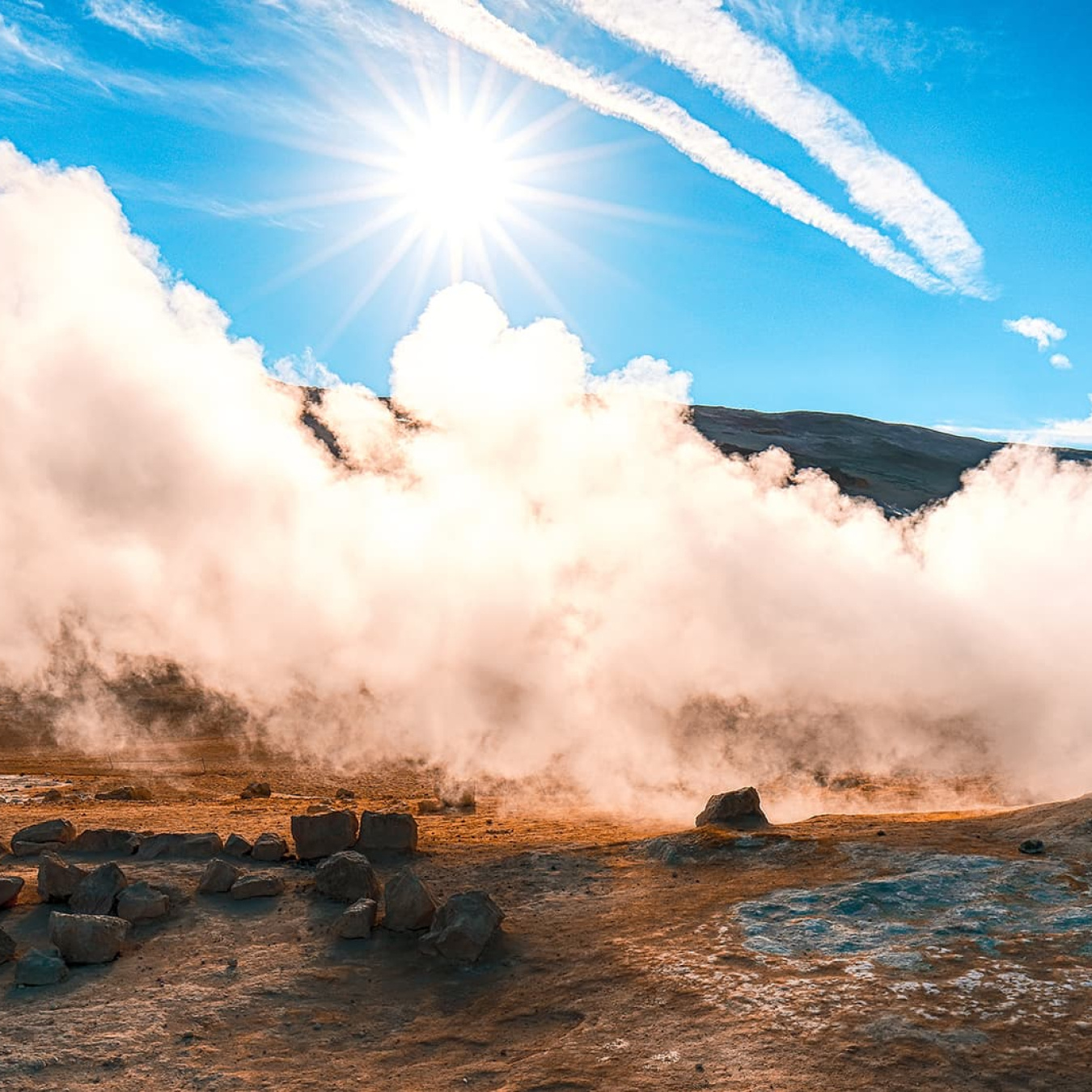 a photo of a steam vent in the desert.