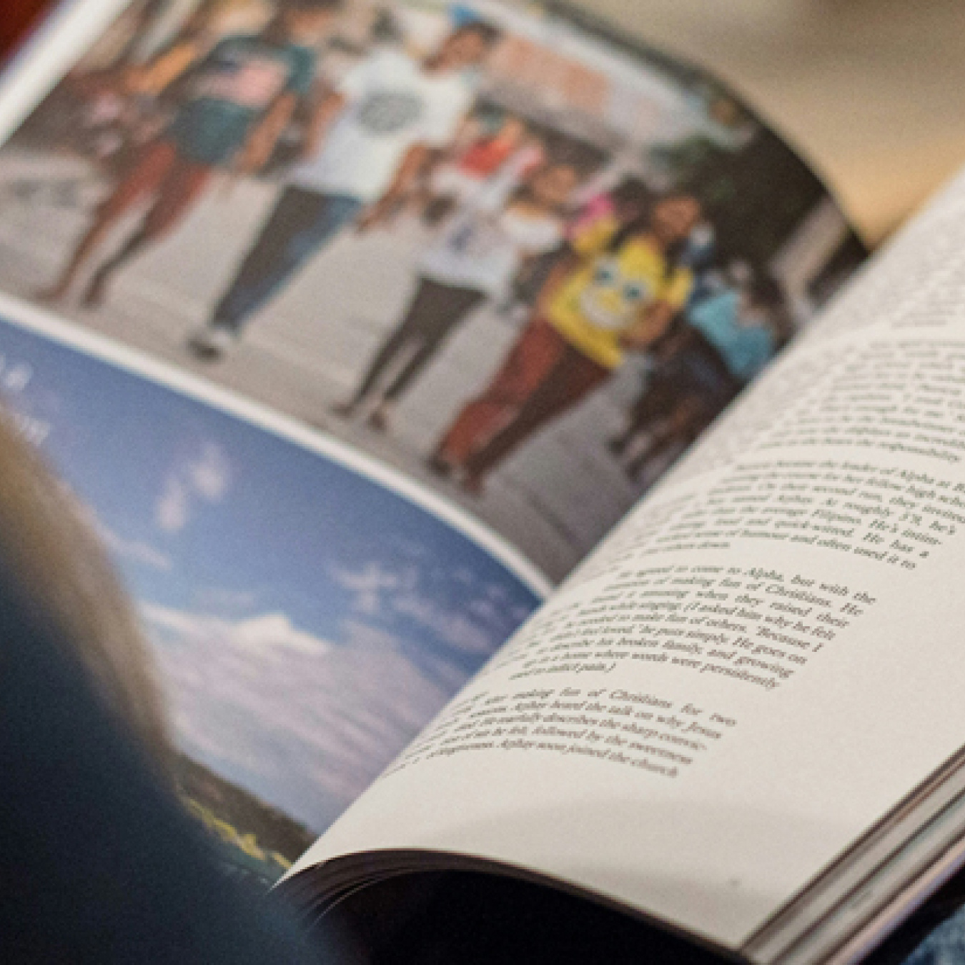 A person looking at a printed magazine