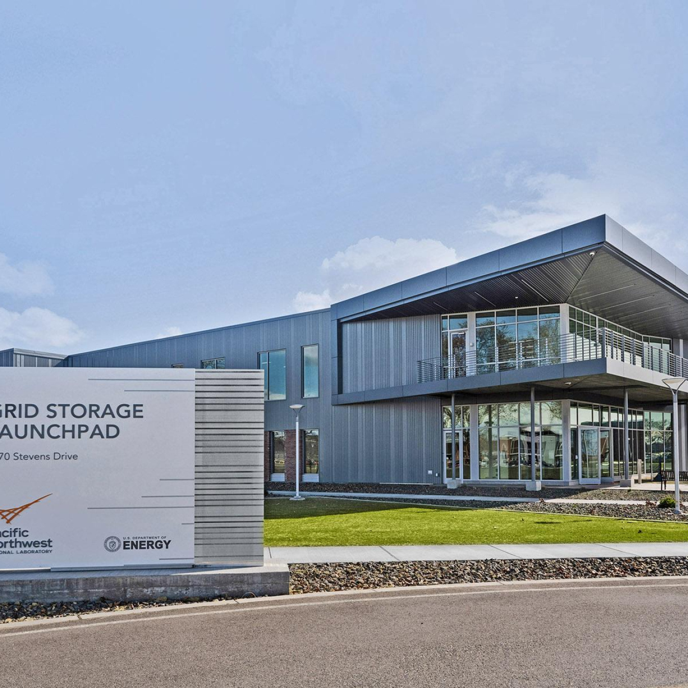 Outside shot of the new Grid Storage Launchpad building at PNNL with the building sign in the foreground. 