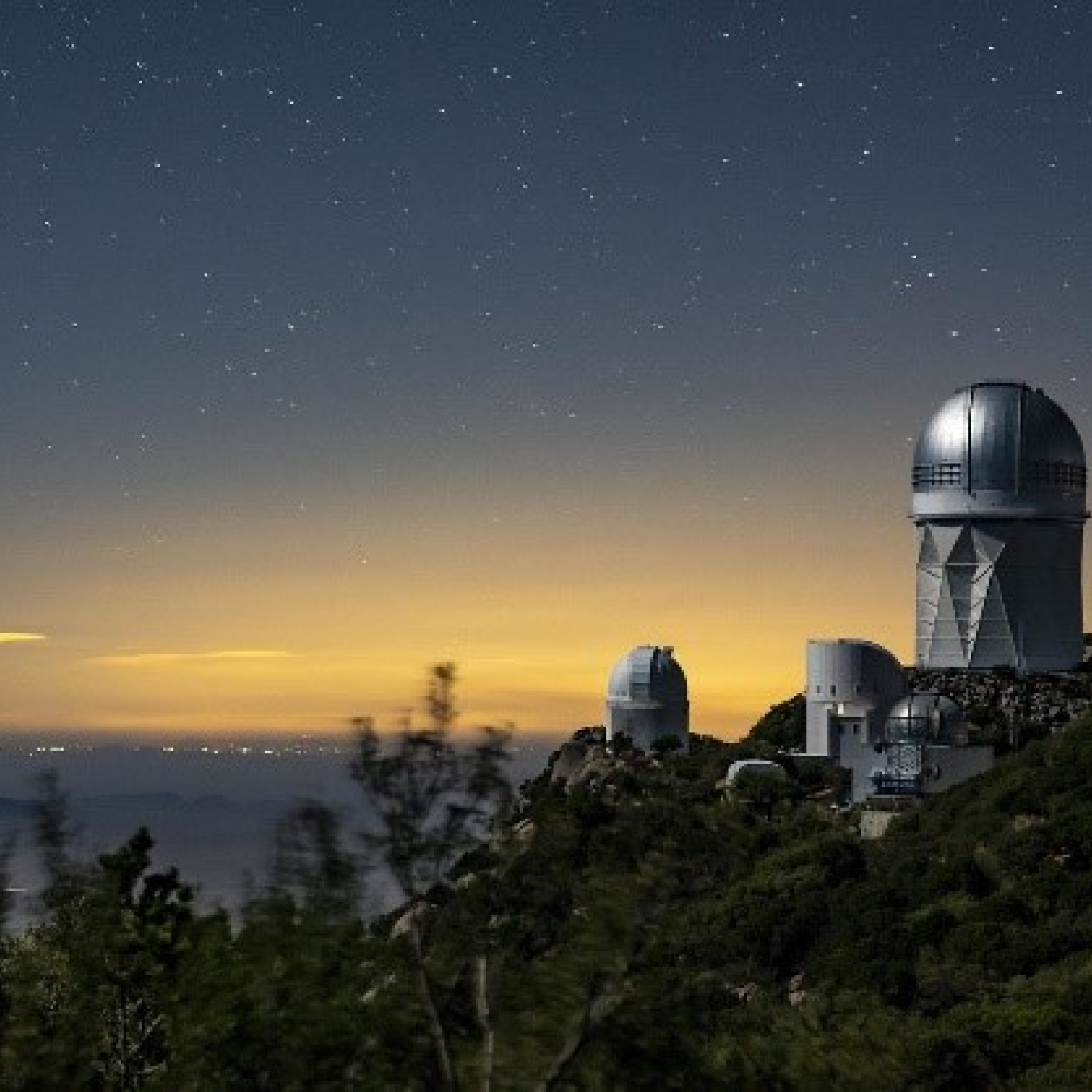The Dark Energy Spectroscopic Instrument at the Mayall Telescope at Kitt Peak National Observatory will use 5,000 robotic “eyes” to map the history of cosmic expansion. 