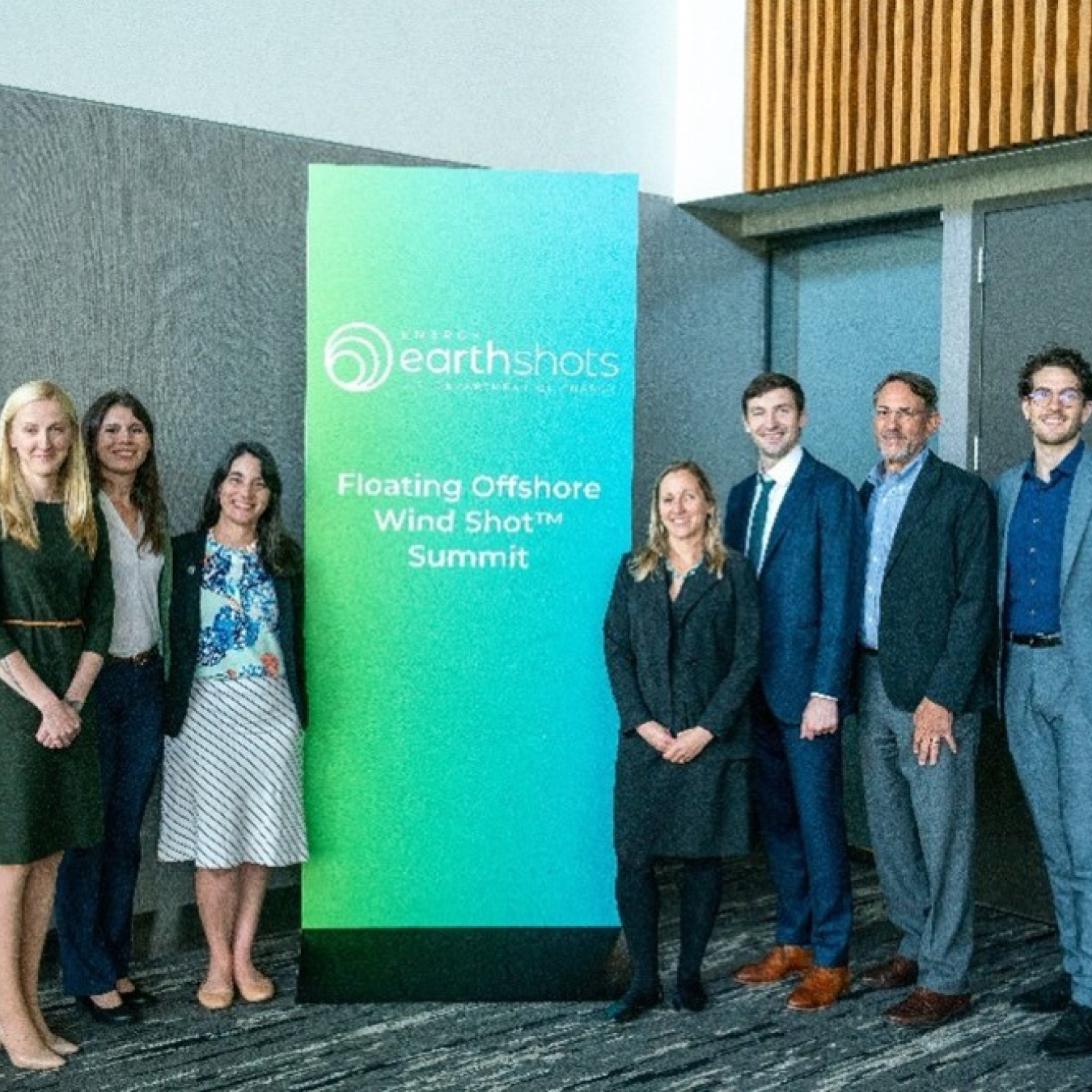 A group of people standing for a photo at a conference
