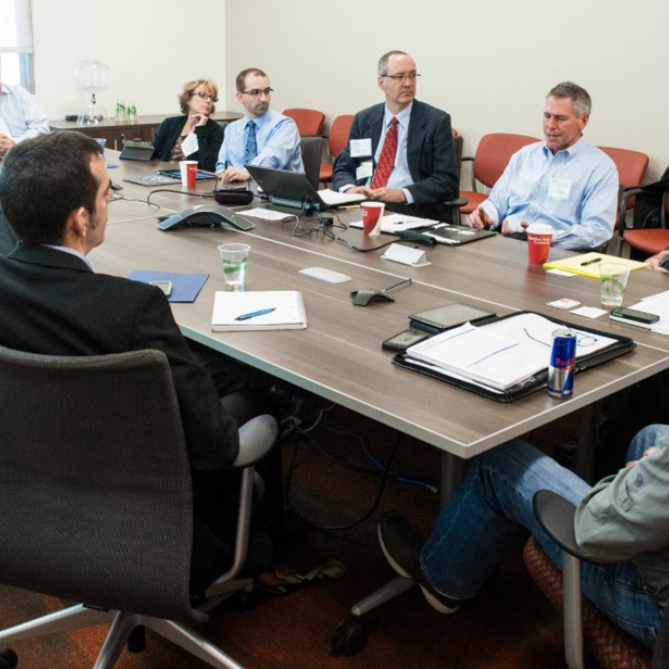 People sitting around a table in a meeting room.