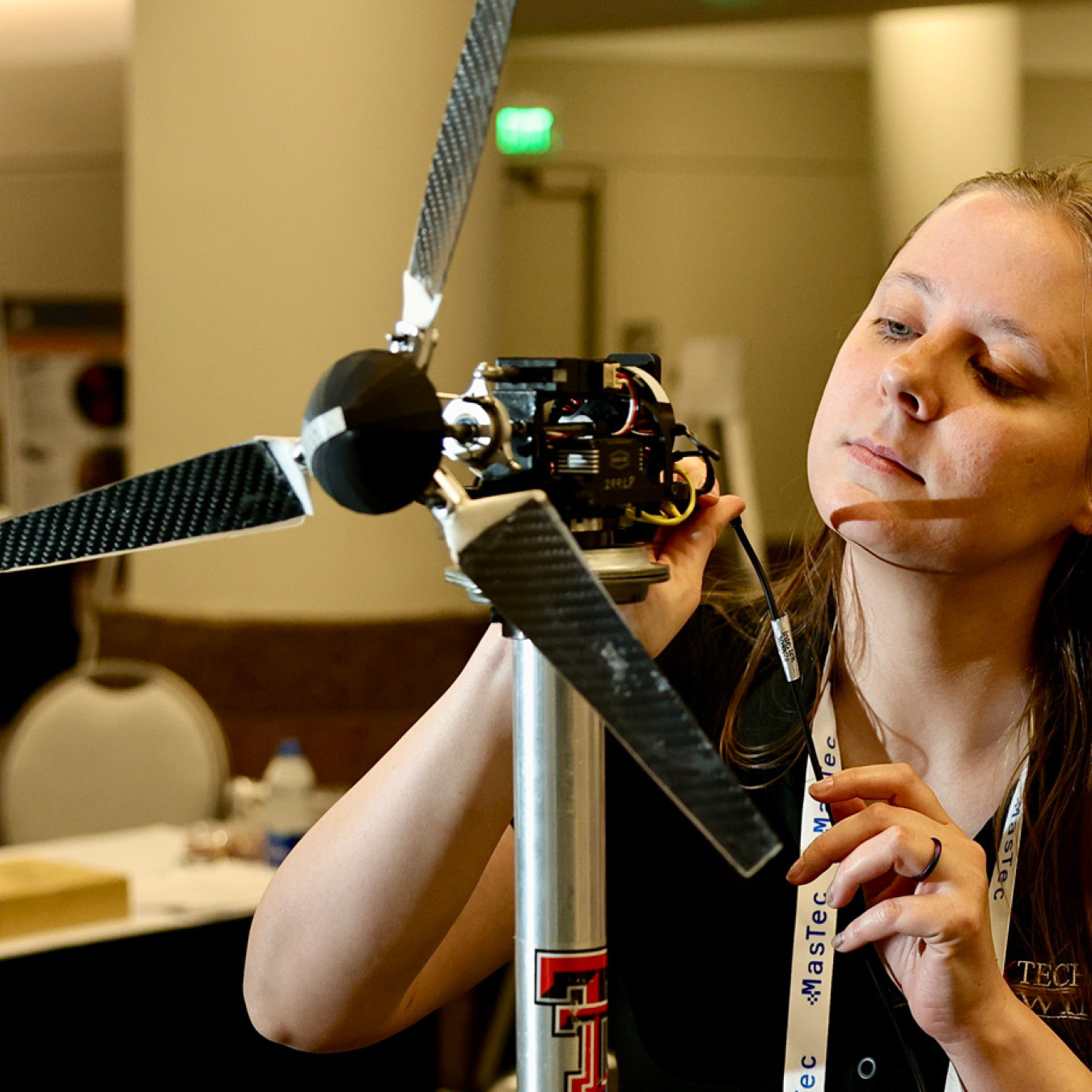 Person working on a wind turbine model