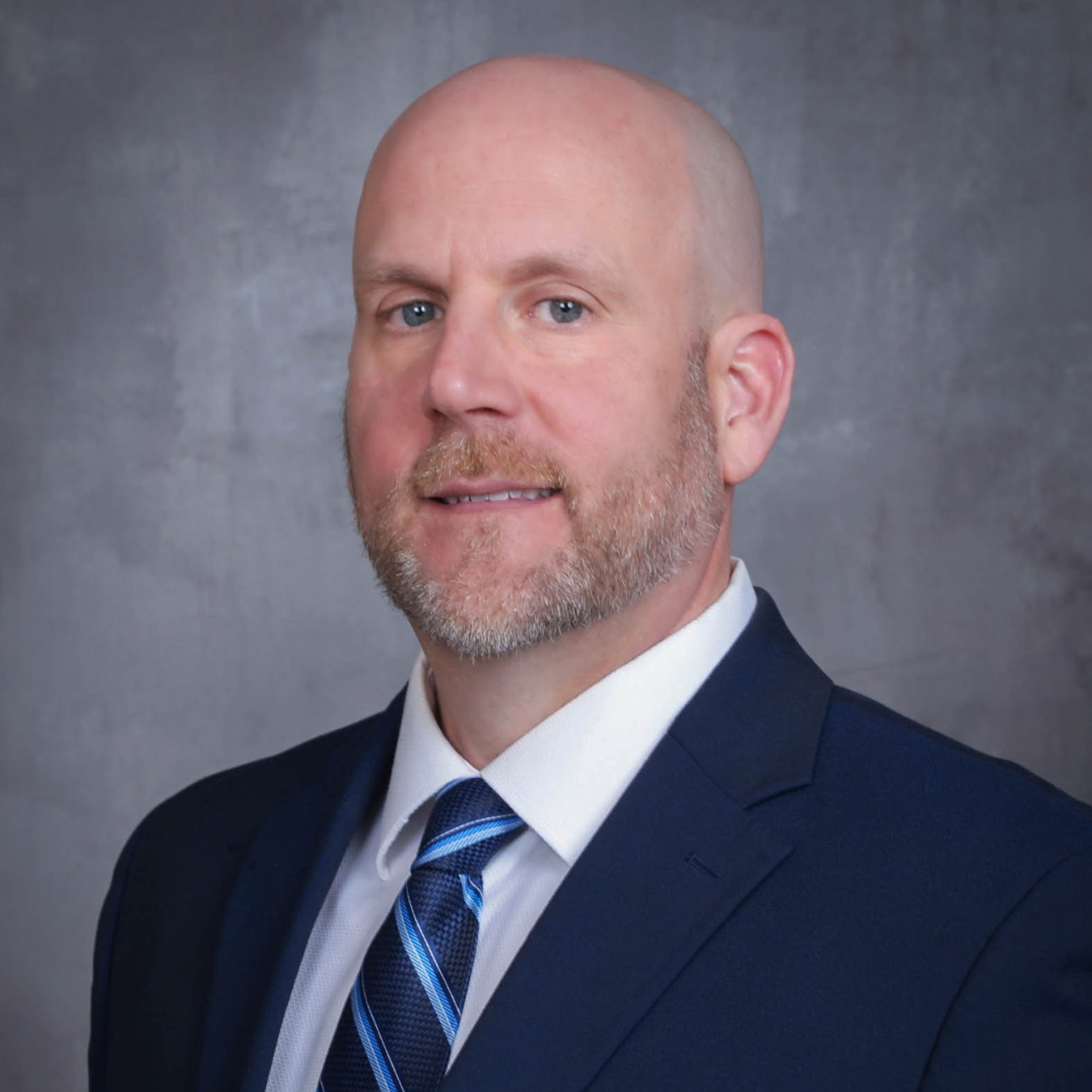 Jeffrey T. Williams wearing a blue suit