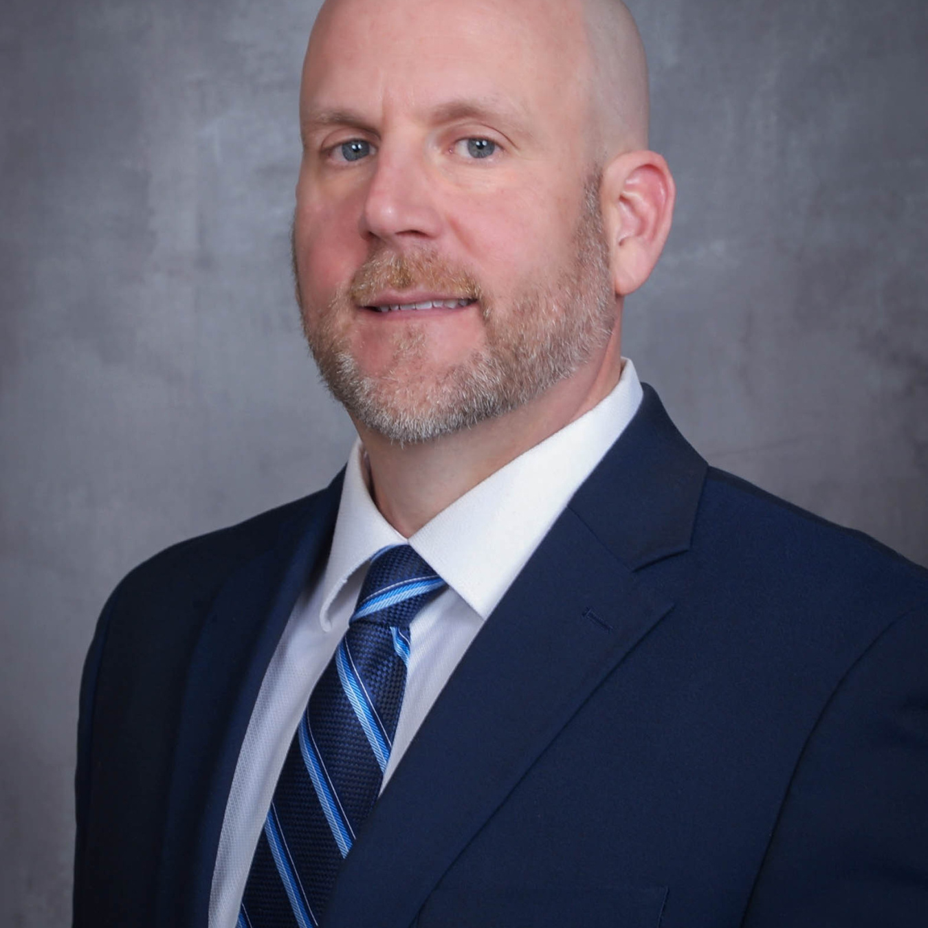 Jeffrey T. Williams wearing a blue suit