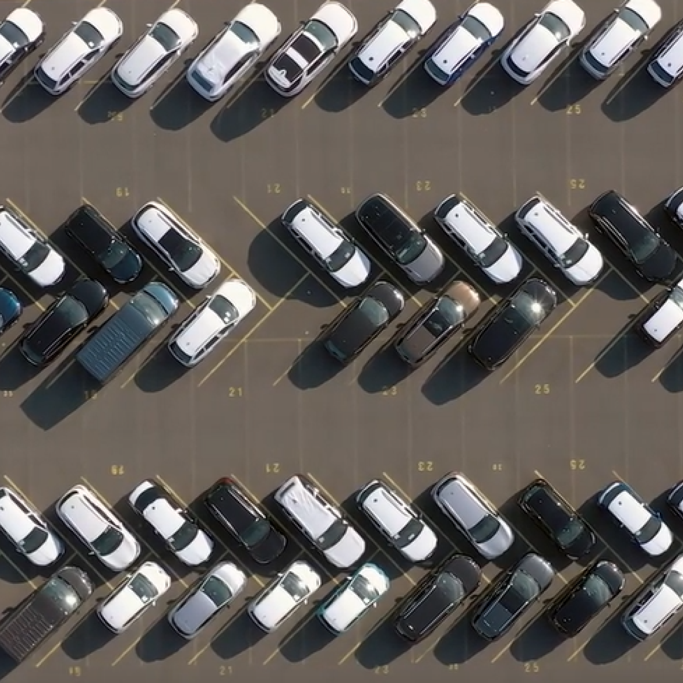Aerial view of vehicles in a parking lot. 