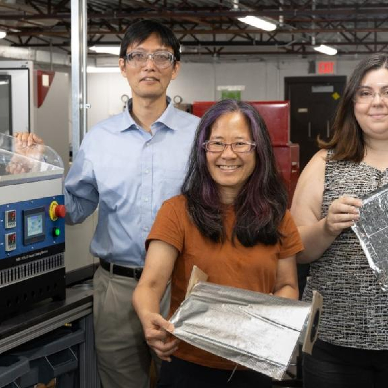 ORNL researchers demonstrate the self-healing barrier film that was licensed by Flexcon to incorporate into vacuum insulation panels. 