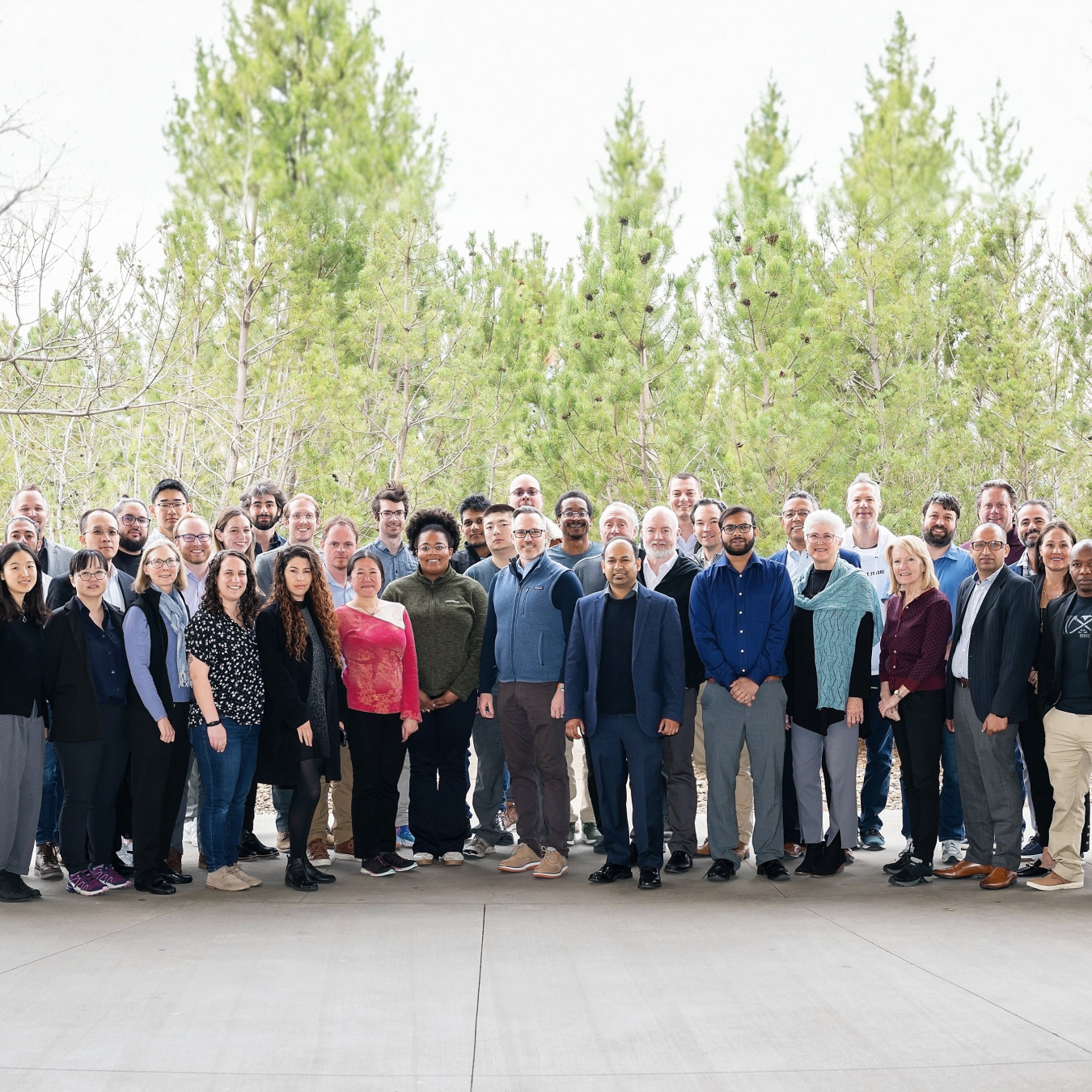 Group of people stands outside