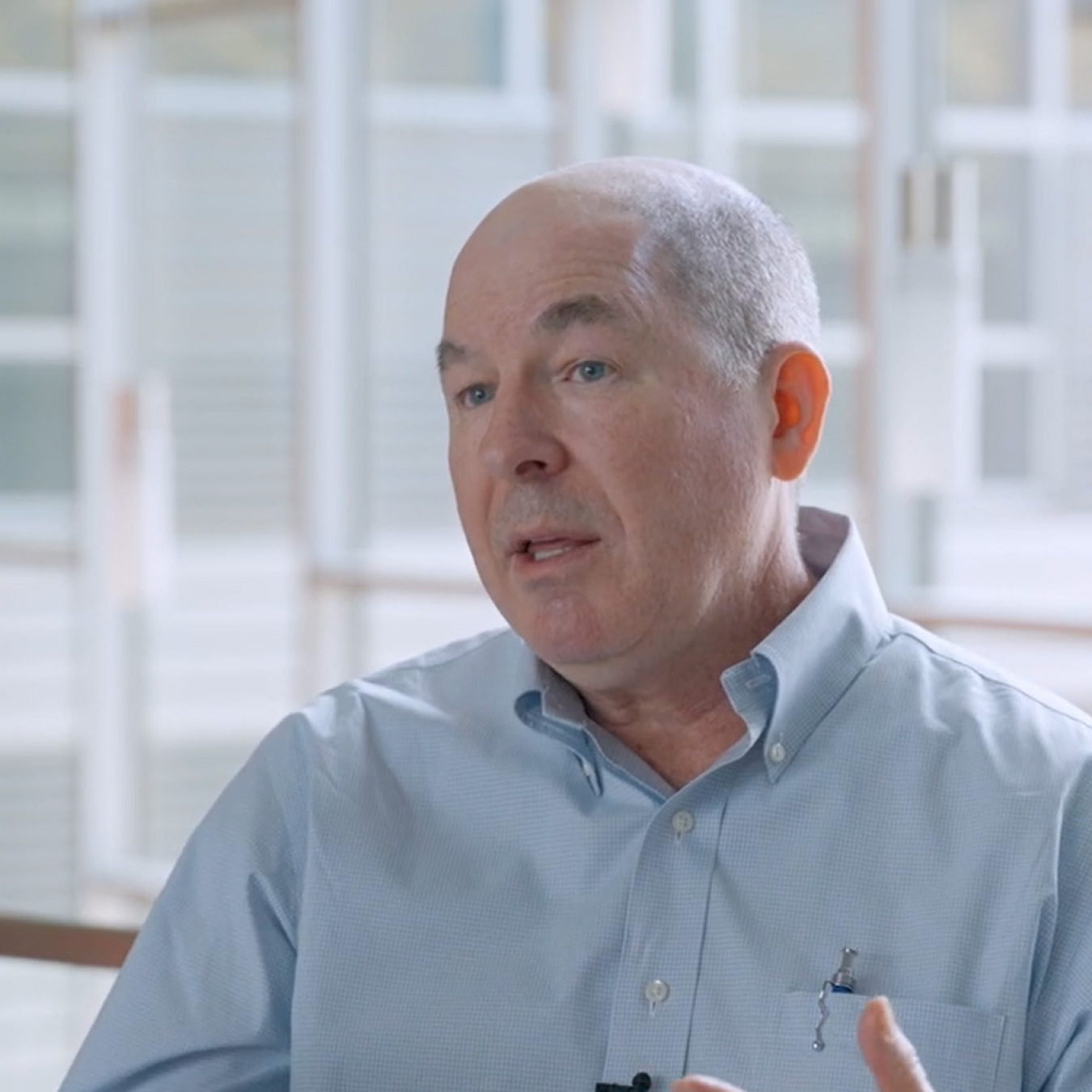 Kurmit Rockwell, Federal Energy Management Program (FEMP) Performance Contracting Team Lead, gestures while speaking about FEMP's performance contracting program.