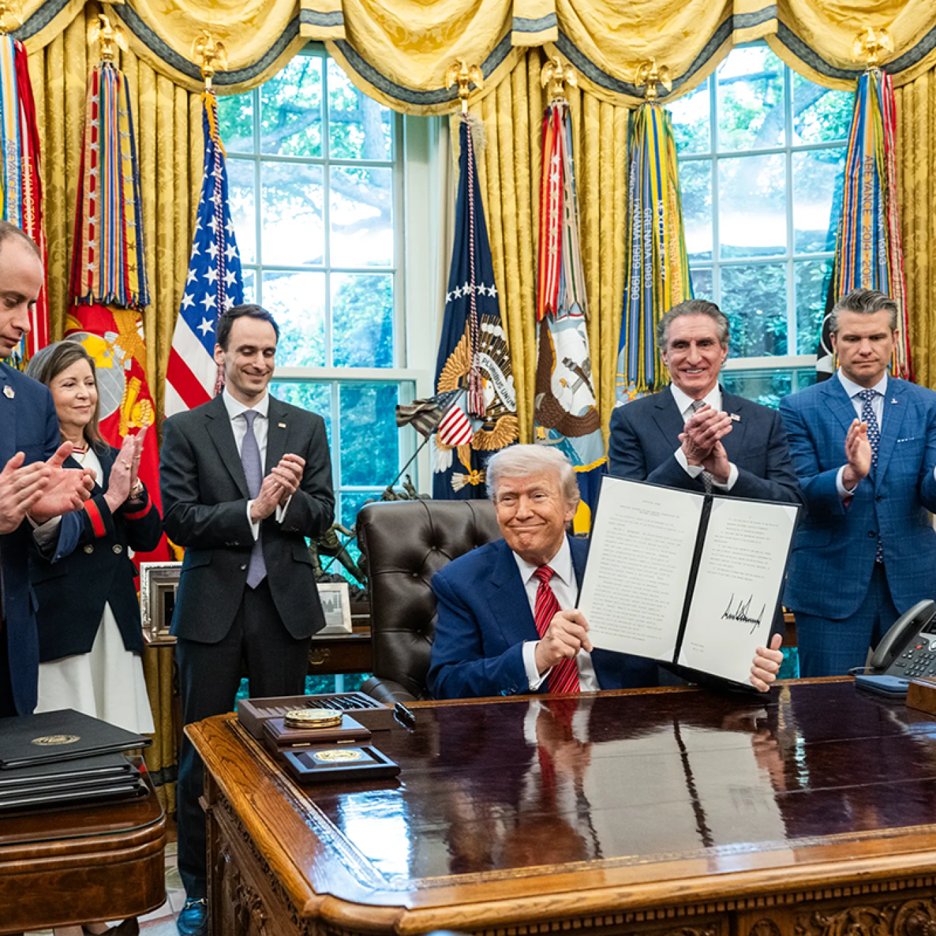 President Trump signing executive orders.