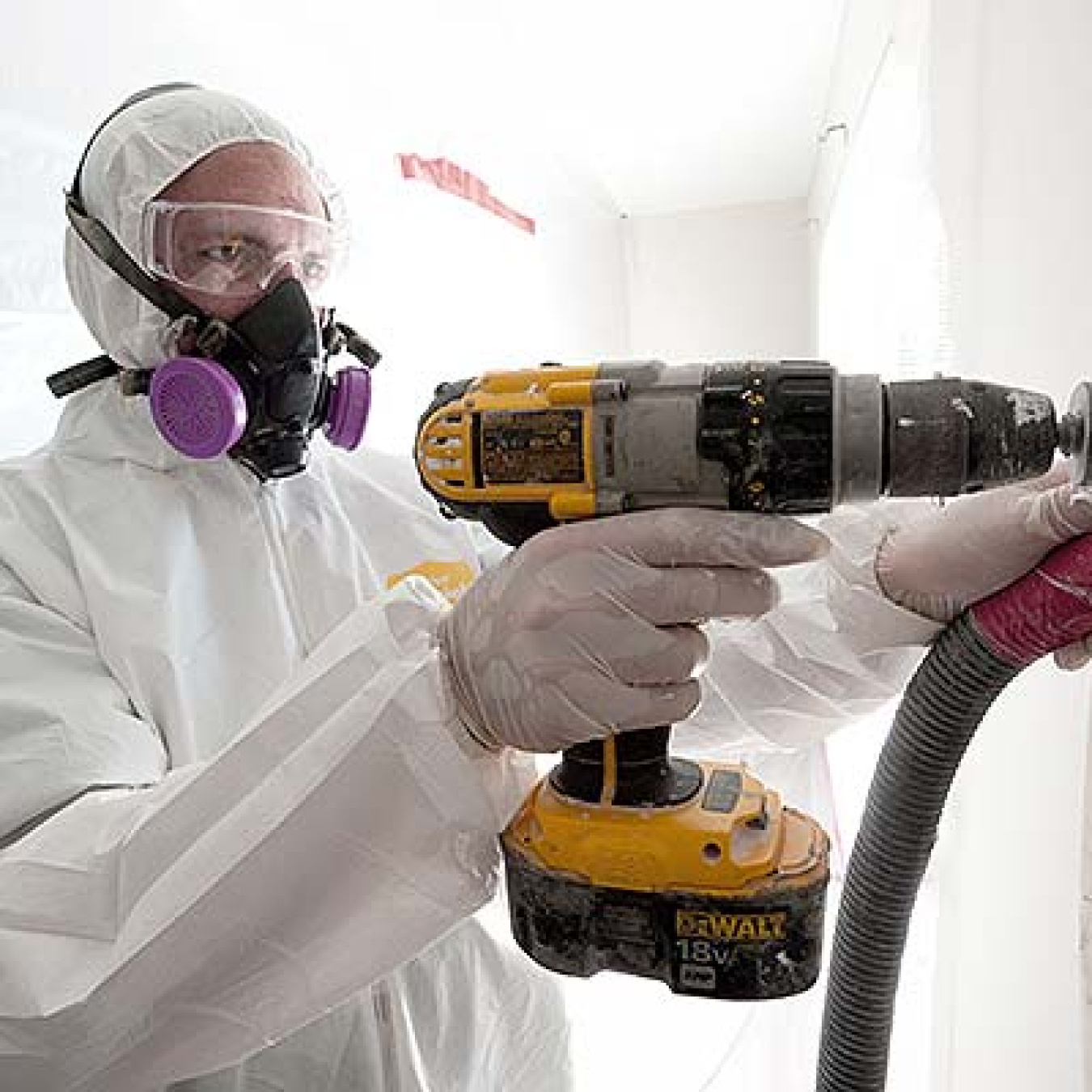 Image of worker weatherizing a wall