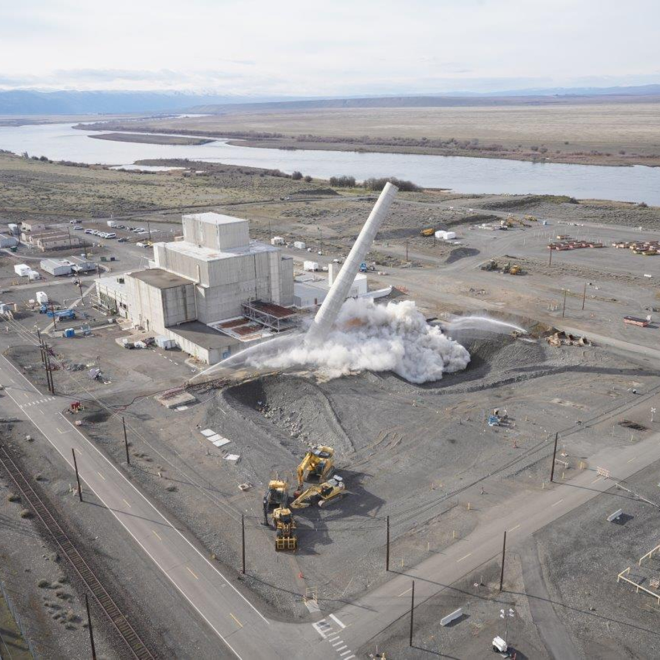 An aerial view of a stack demolition taking place at the Hanford Site