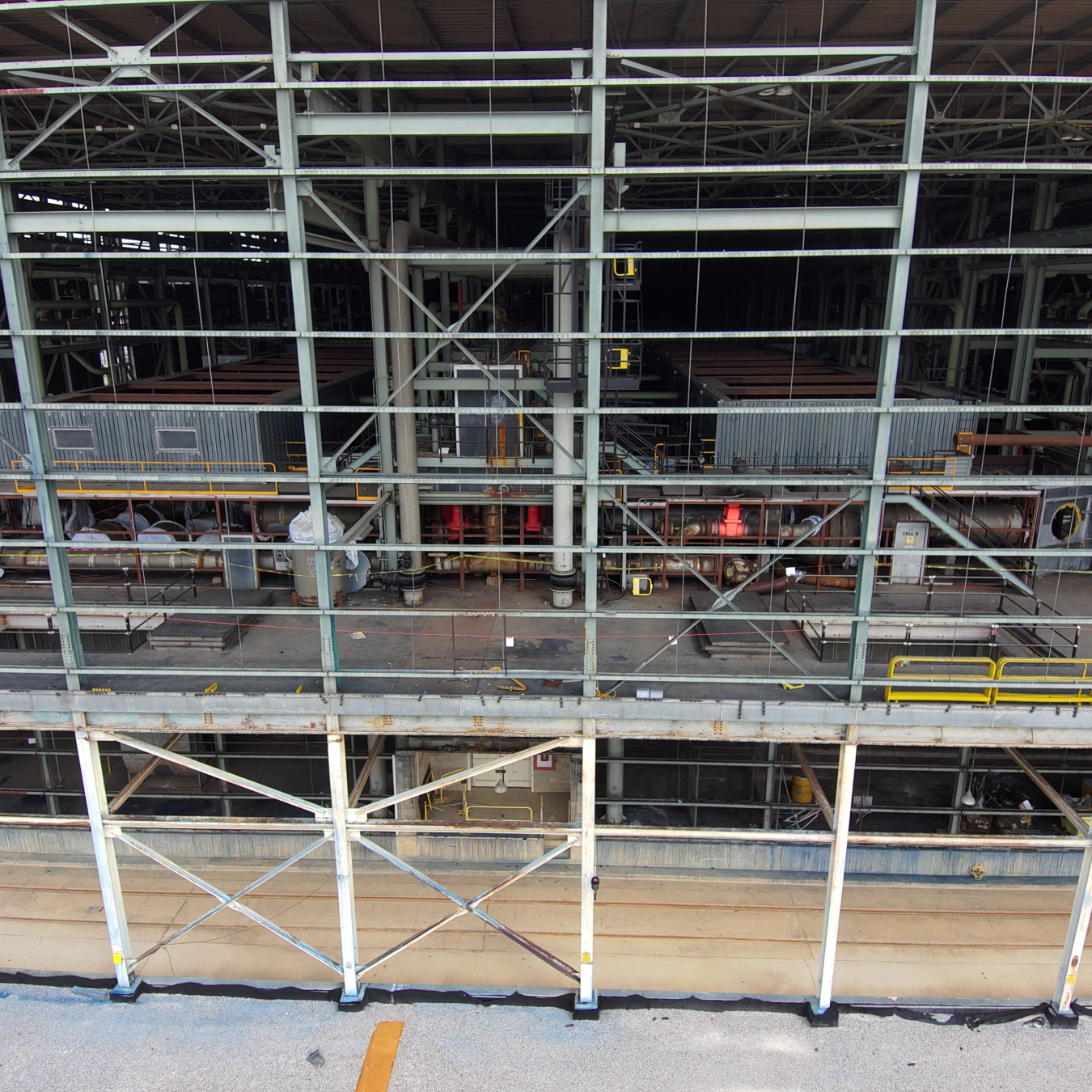Open section of a large facility building with brightly colored valves at the Portsmouth Site