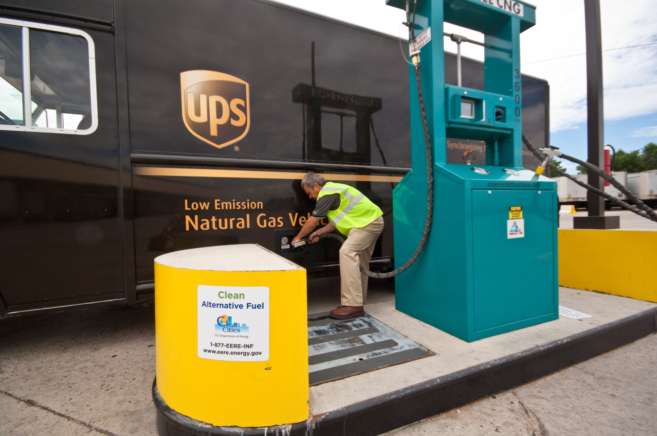 Photo of a man fueling a natural gas UPS truck