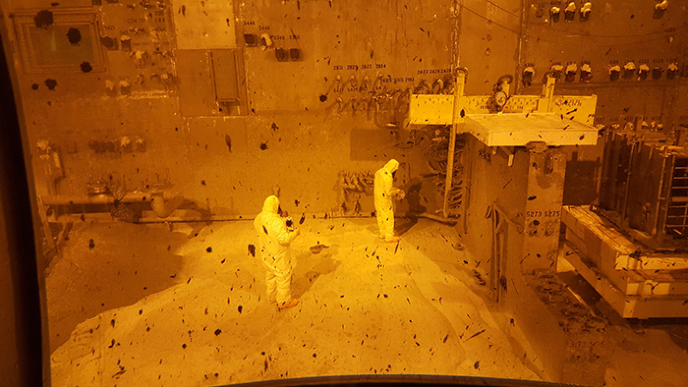 Workers stand inside EM's West Valley Demonstration Project's Vitrification Facility after the facility was declared demolition-ready.