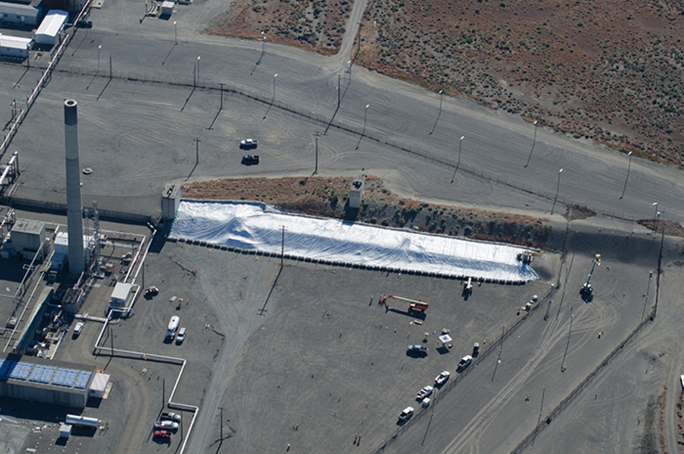 Aerial photos show the white protective cover over the tunnel. 