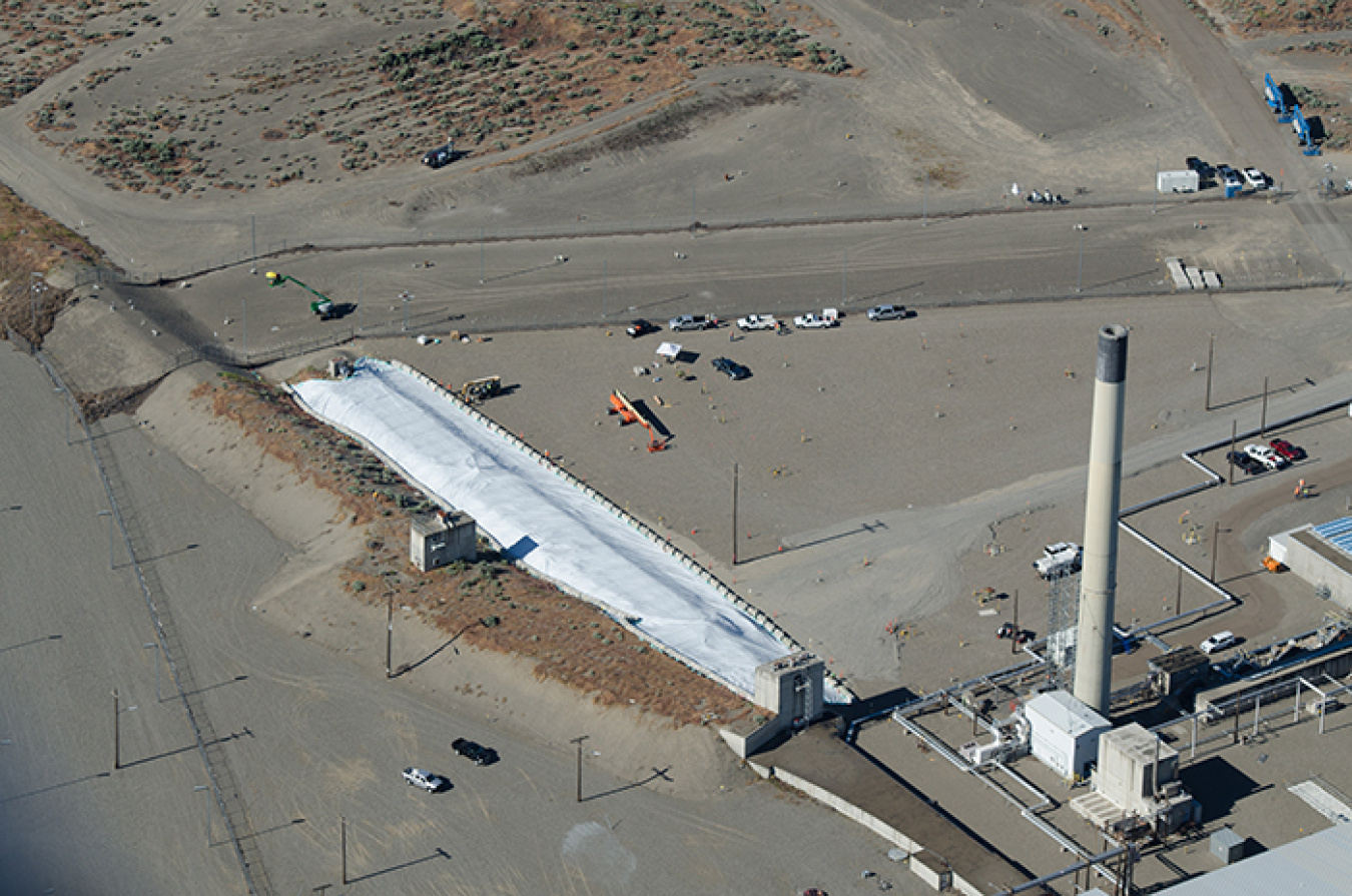 Aerial photos show the white protective cover over the tunnel. 