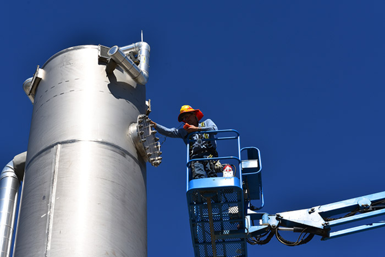 An employee with Bechtel National works on one of the non-radioactive liquid waste disposal (NLD) system’s air stripper towers at WTP.