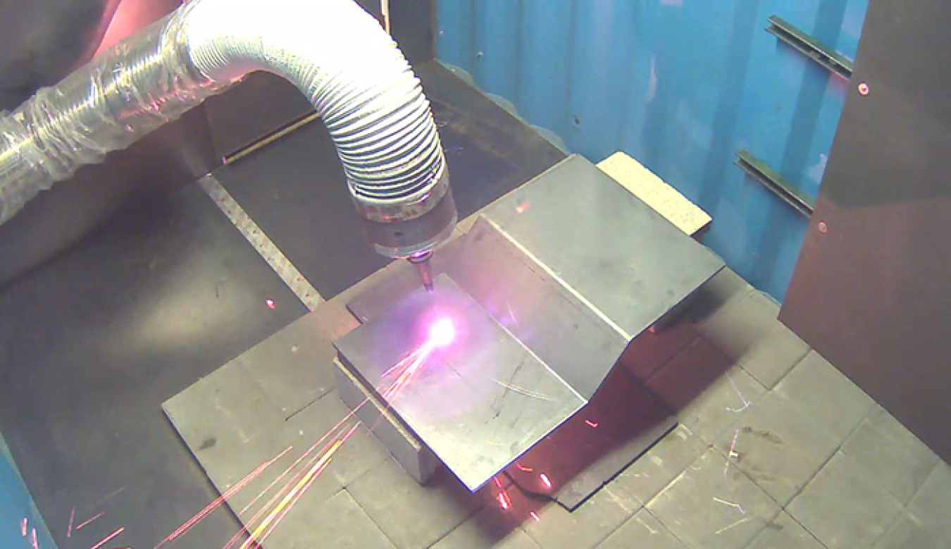 The "snake arm" robot follows the contour of an angled piece of steel.