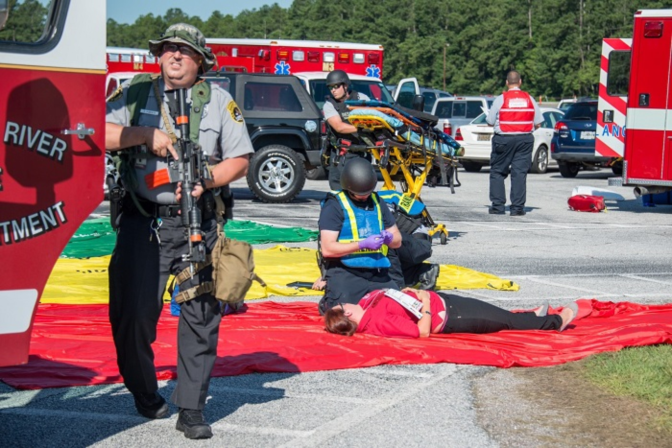 Members of the SRS Rescue Task Force team provide medical attention to victims in the mock event.