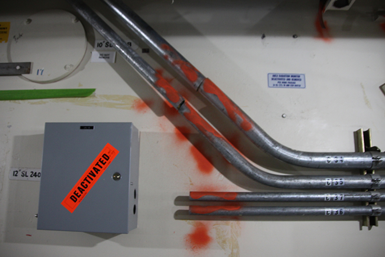 Marking conduit with orange paint helps workers determine it is deactivated before it can be removed.