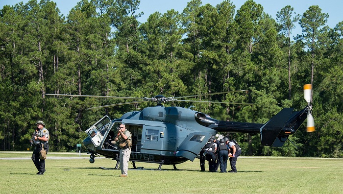The Centerra-SRS Pro-Force team provides coverage during a medical evacuation of victims in the emergency response exercise.